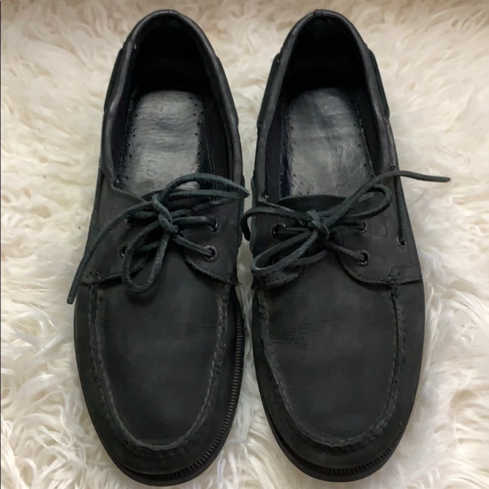 Sperrys black shoes.